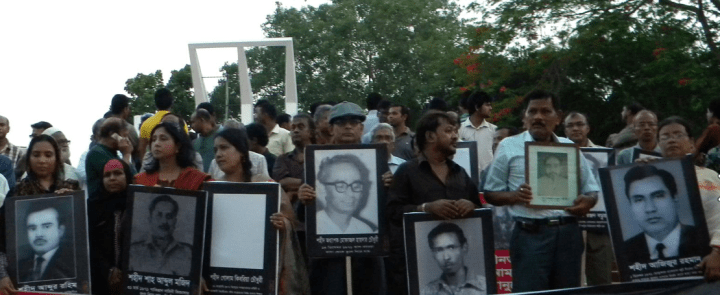 Children of intellectuals assassinated in 1971 hold silent vigil at Shaheed Minar.
