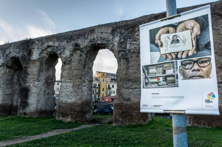 "Panels of the photographic exhibition in Tor Pignattara. Now the panels have been cleaned by the authors of the pictures who, while doing it, received the support and cheering of the passers by and the shopkeepers." Photo: Luisa Fabriziani